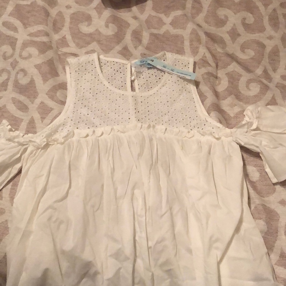 She and sky white cold shoulder top. Size M